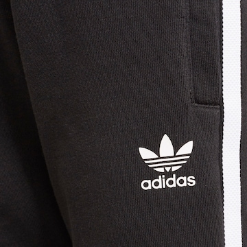 ADIDAS ORIGINALS Juoksupuku värissä musta