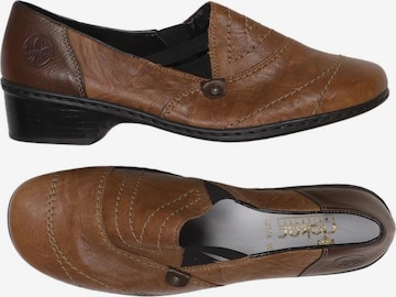 Rieker Flats & Loafers in 39 in Brown: front