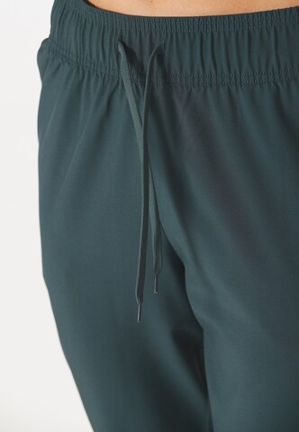 ENDURANCE Tapered Sports trousers 'Chaya' in Green