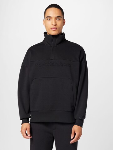 Sweat-shirt Calvin Klein Jeans en noir : devant