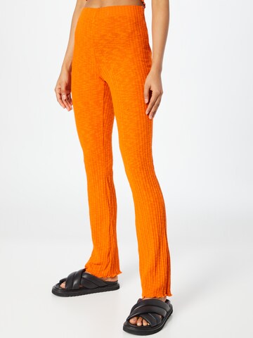NEON & NYLON Flared Pants 'FAYE' in Orange: front