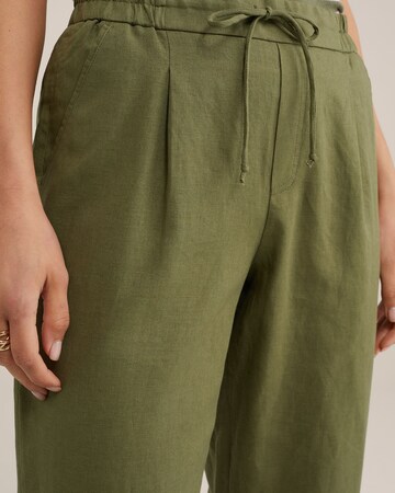 WE Fashion Loose fit Trousers in Green