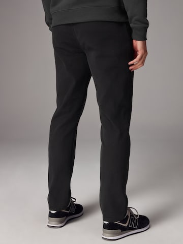 Slimfit Pantaloni chino di Next in nero