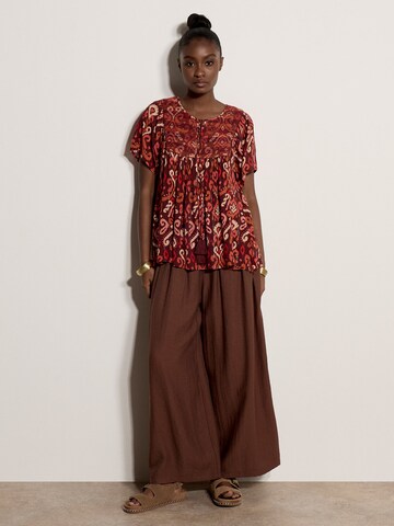 Haut ' ' Apricot en rouge