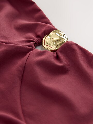 Next - Top en rojo