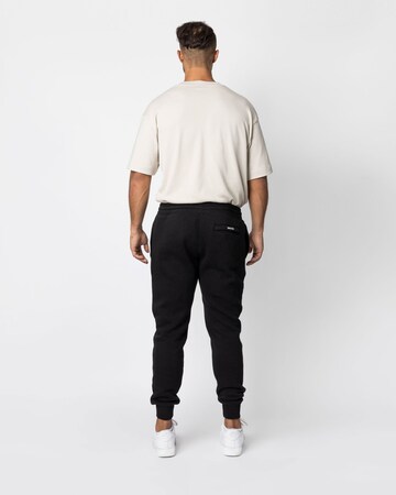 SNOCKS Tapered Jogginghose in Schwarz