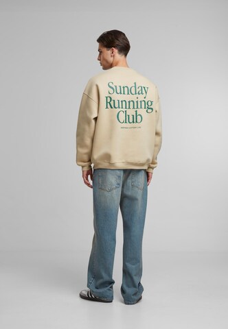 Another Cotton Lab Свитшот 'Sunday Running Club' в Бежевый