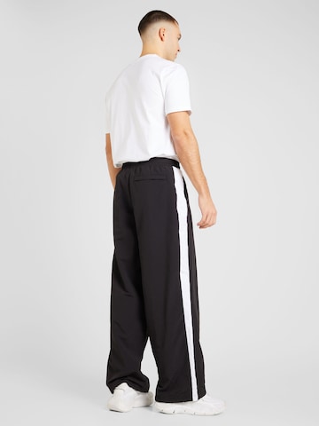 Loosefit Pantaloni 'T7' di PUMA in nero