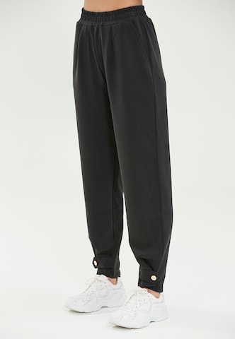 Athlecia Loose fit Workout Pants 'Nikoni' in Black: front