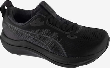 Chaussure de course ASICS en noir : devant