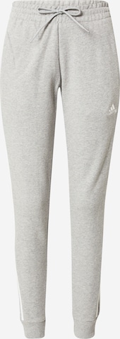 ADIDAS SPORTSWEAR - Tapered Calças de desporto 'Essentials' em cinzento: frente