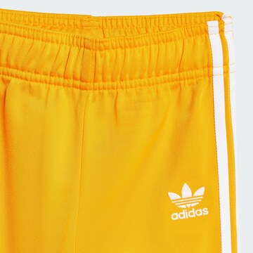 Tuta da jogging 'Adicolor' di ADIDAS ORIGINALS in giallo