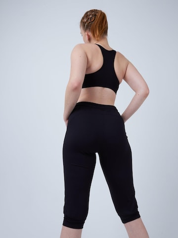 SPORTKIND Loosefit Sporthose 'Caprihose mit Taschen'‌‌‌‌‌ in Schwarz