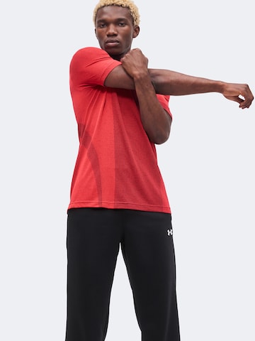UNDER ARMOUR Tapered Sportbyxa i svart