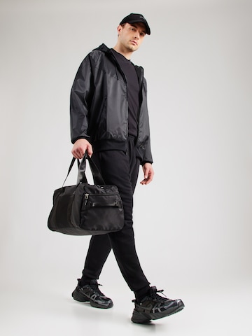 Geacă de primăvară-toamnă 'Heritage Essentials' de la Nike Sportswear pe negru