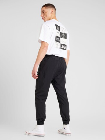 new balance Конический (Tapered) Спортивные штаны 'Essentials Active' в Черный