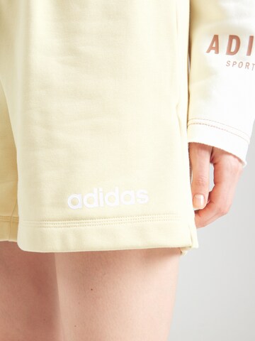 ADIDAS SPORTSWEAR Loosefit Sportovní kalhoty 'Essentials' – žlutá