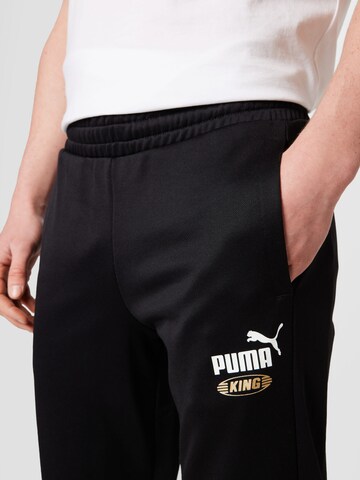 Effilé Pantalon de sport 'King' PUMA en noir