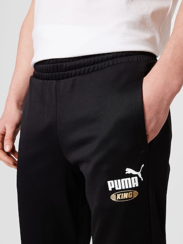 Effilé Pantalon de sport 'King' PUMA en noir