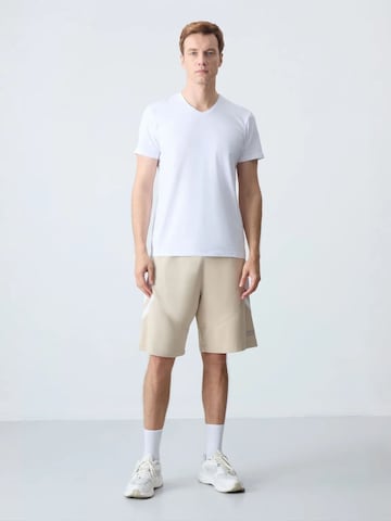 Regular Pantalon Tommy Life en mélange de couleurs