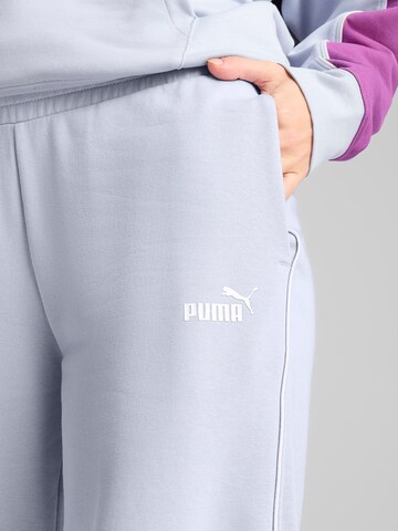 PUMA Tapered Sports trousers in Blue