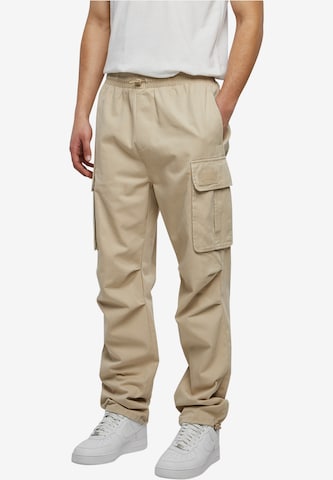 Karl Kani Loose fit Cargo trousers in Beige: front