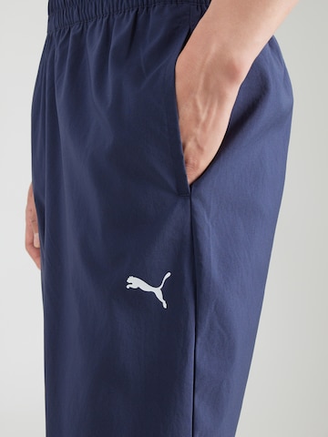 PUMA Zwężany krój Spodnie sportowe 'TAD ESSENTIALS' w kolorze niebieski