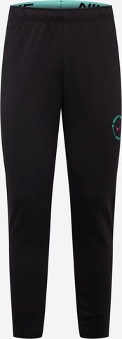 Tapered Pantaloni sportivi di NIKE in nero: frontale