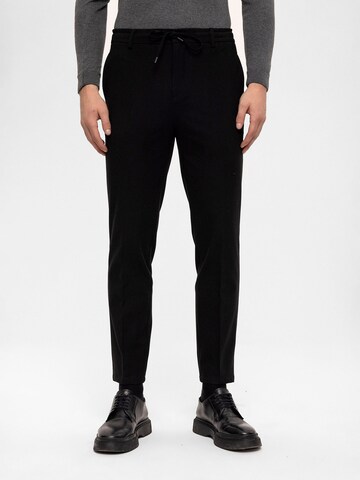 Antioch Slim fit Trousers in Black: front