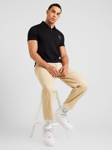 GUESS Poloshirt 'NOLAN' in Schwarz