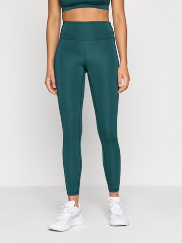 PUMA Skinny Fit Спортен панталон в зелено: отпред