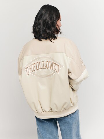 UNFOLLOWED x ABOUT YOU Between-Season Jacket 'MOST WANTED' in Beige: back