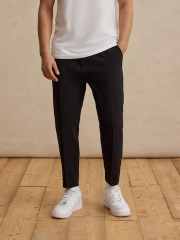 DAN FOX APPAREL Regular Pleat-Front Pants 'Toni' in Black: front