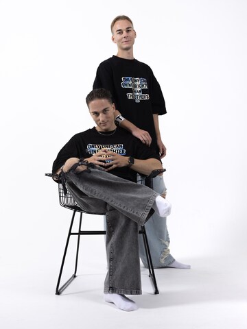 BTY Oversized tričko 'Unisex Oversized T-shirt' – černá