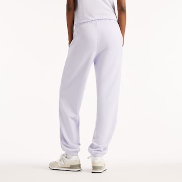 Tapered Pantaloni 'Sport Essentials French Terry Jogger' di new balance in lilla