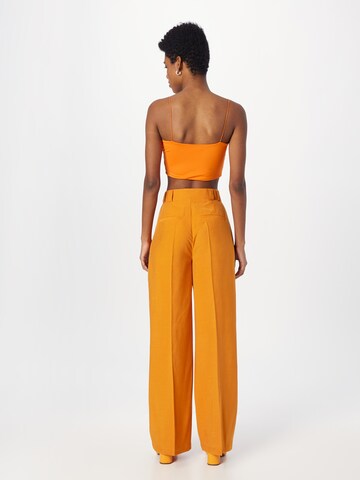 Wide leg Pantaloni cu dungă 'MERCEDES' de la NÜMPH pe portocaliu