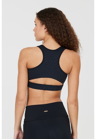 Athlecia Medium Support Urheilurintaliivit 'Tiya' värissä musta