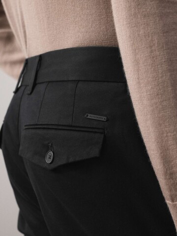 Slimfit Pantaloni di Marks & Spencer in nero