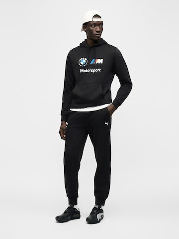 PUMA Collegepaita 'BMW MMS Ess' värissä musta
