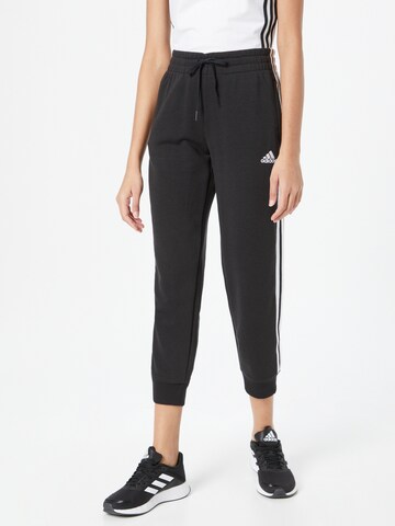 ADIDAS SPORTSWEAR - Tapered Pantalón deportivo 'Essentials Studio Lounge Cuffed 3-Stripes' en negro: frente