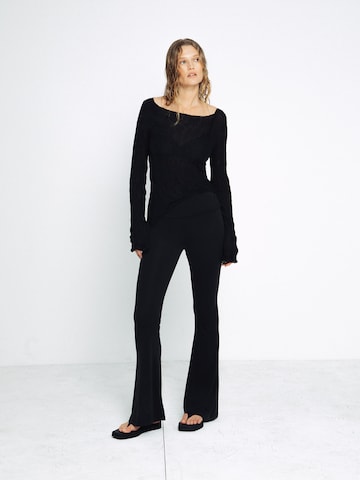ABOUT YOU x Toni Garrn Flared Trousers in Black