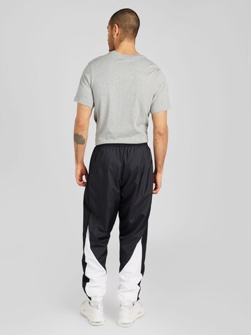 NIKE - Tapered Pantalón deportivo 'START5' en negro