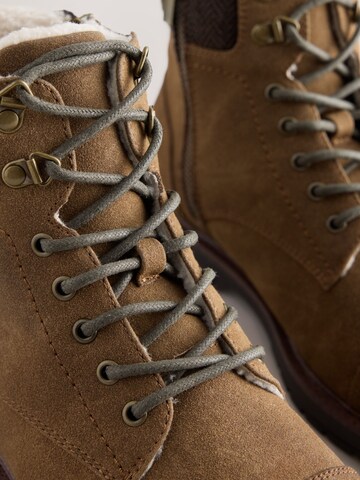 Next - Botas con cordones en marrón