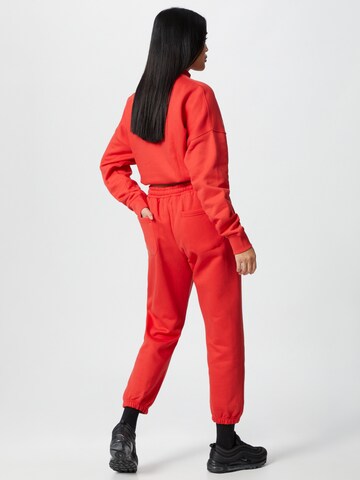 ABOUT YOU x Mero Loose fit Pants 'Code' in Red