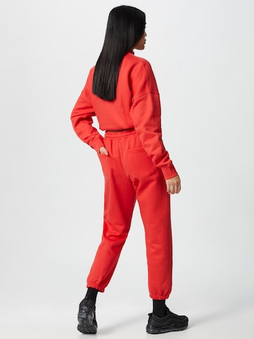 ABOUT YOU x Mero Loose fit Pants 'Code' in Red