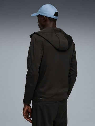 PUMA - Chaqueta deportiva 'Puma Evostripe Warm Fz Hoodie' en negro