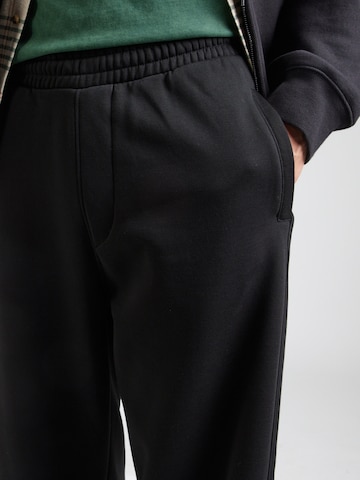 WEEKDAY Loosefit Housut värissä musta