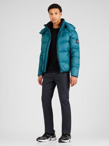Calvin Klein Jeans Zimná bunda 'ESSENTIAL' - Modrá