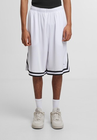 Karl Kani Loose fit Pants 'Signature' in Mixed colors