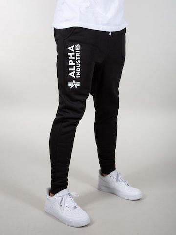 Effilé Pantalon ALPHA INDUSTRIES en noir